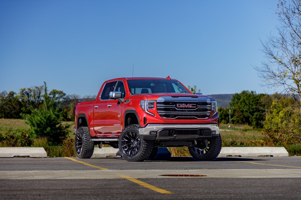 2024 GMC Sierra 1500 with a 6" Rough Country lift kit, 22x12 Fuel Flame wheels, and 35" Fury Country Hunter R/T tires. 