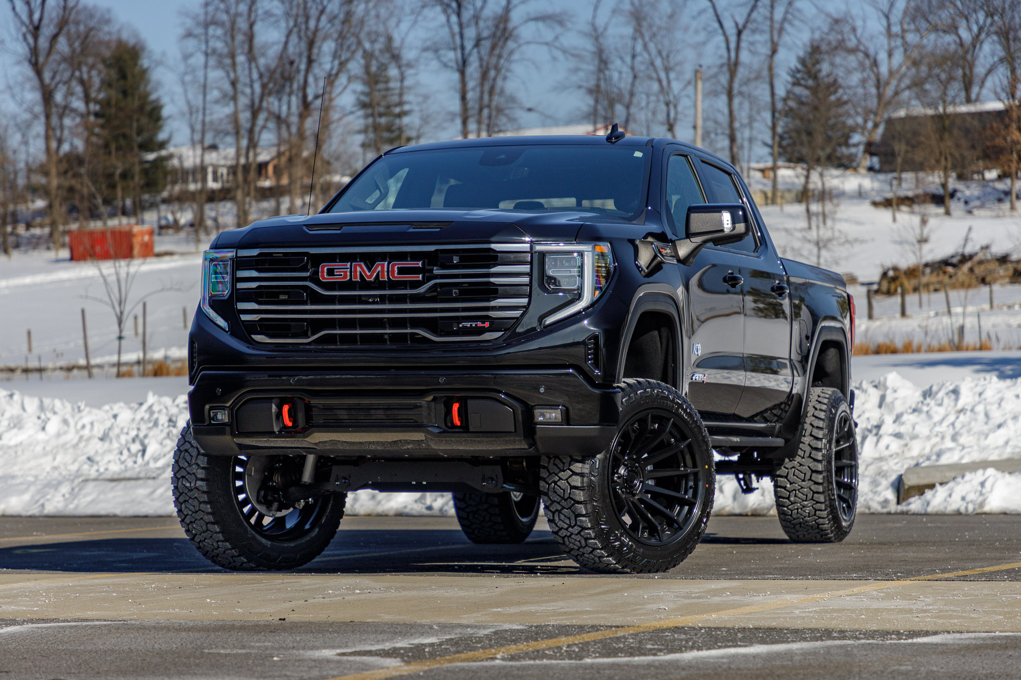 2025 GMC Sierra 1500 AT4 with a 6" Rough Country lift kit, 22x12 Fuel Burn wheels, and 35" Fury Country Hunter R/T tires. 