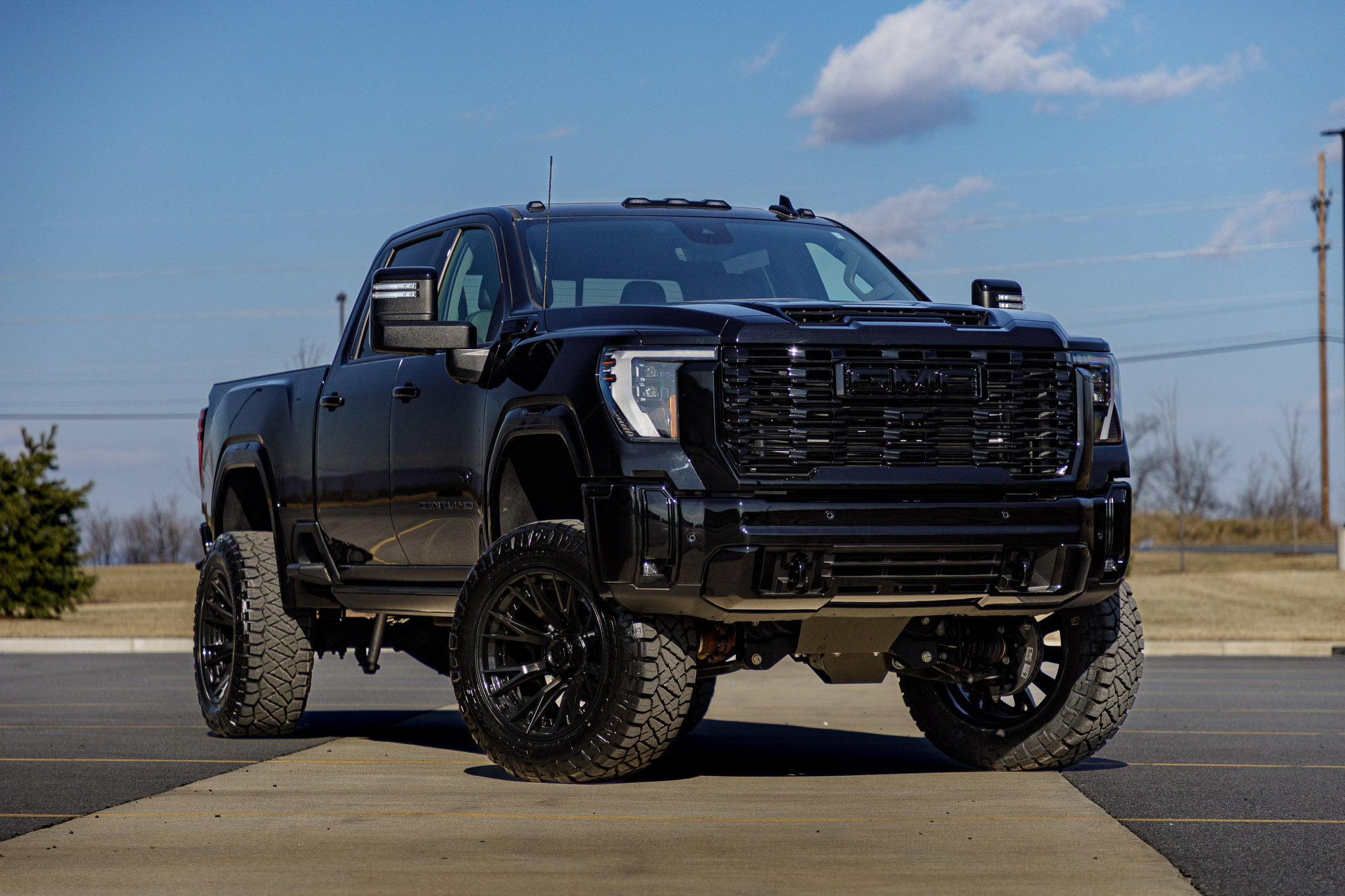 2025 GMC Sierra 3500 Denali with a BDS 5" lift kit, 22x12 Fuel Catalyst wheels, and 37" Nitto Ridge Grappler tires. 