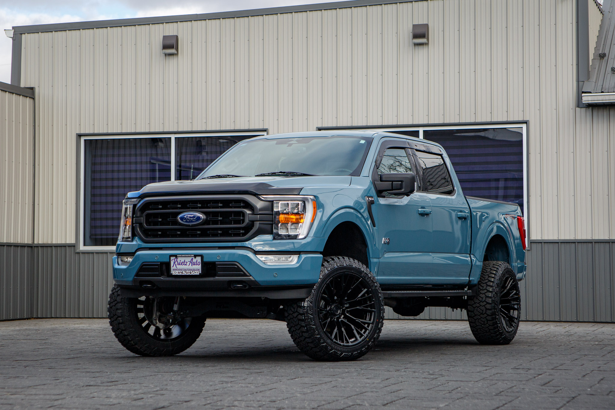 2023 Ford F-150 XLT with a 6" Rough Country lift kit, 22x12 Fuel Rebar wheels, and 35" Fury Country Hunter R/T tires.