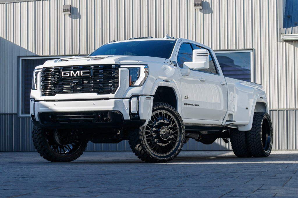 2025 GMC Sierra 3500 Denali Ultimate with a 4" CST lift kit, 26x8.25" American Force Plague wheels, and 37" AMP Terrain Attack M/T A tires.