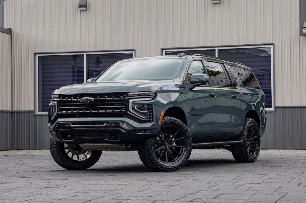 A 2026 Chevrolet Suburban Z71 with a 2" Rough Country lift kit, 22x9.5" Vossen HFX2 wheels, and 35" Nitto Ridge Grappler tires. 